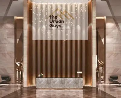 a lobby of a hotel with a sign on the wall at Livo in Dubai