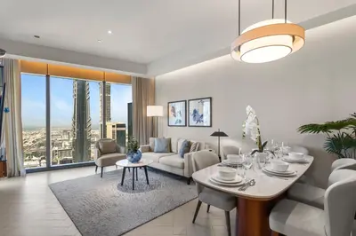 a living room with a couch and a table at High-End 2Bedroom Near Dubai Opera & Mall in Dubai