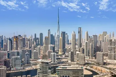 a view of a large city with skyscrapers at VayK - Luxurious 3BR in Business Bay with Burj Khalifa View in Dubai