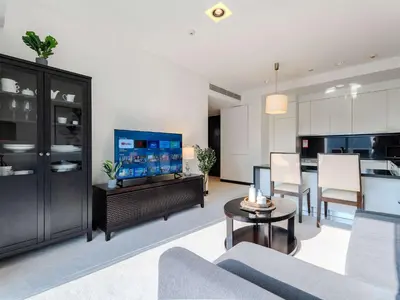 a living room with a couch and a table at Incredible Views at The Address Dubai Marina 1BR in Dubai