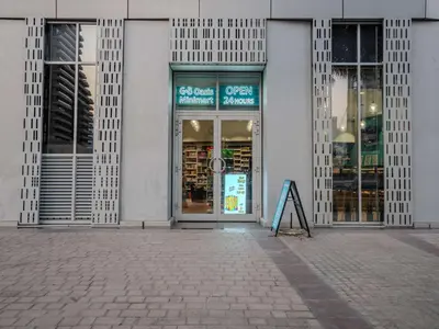 a store front with a sign in front of it at Cayan Tower, The Twist - Marina Views & Free Pool in Dubai
