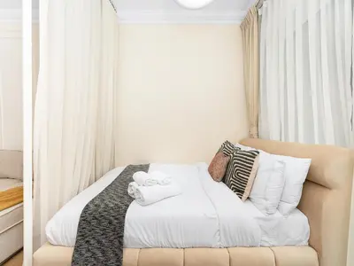 a bedroom with a bed with white sheets and pillows at New Lux 3BR Apartment High Floor Prime Location BCOM in Dubai