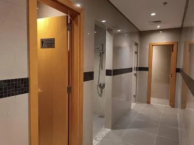 a bathroom with a shower stall and a walk in shower at Modern Studio - Lincoln Park West - Dubai, Arjan in Dubai