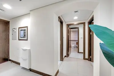 a hallway in a house with white walls at Luxury 2BR Escape - Durar 1B 2, Wadi Al Safa in Dubai