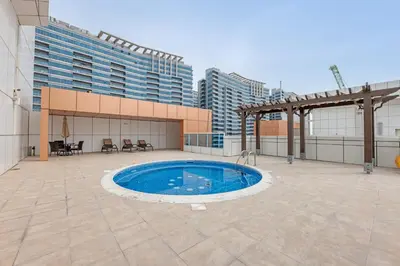 a swimming pool on the roof of a building at Luxury 2BR Escape - Durar 1B 2, Wadi Al Safa in Dubai