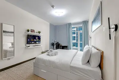 a bedroom with a bed with two stuffed animals on it at Luxury 2BR Escape - Durar 1B 2, Wadi Al Safa in Dubai