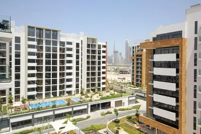 an aerial view of a city with tall buildings at Chic Riviera 27 - 1BHK - Pool , Gym , Parking in Dubai