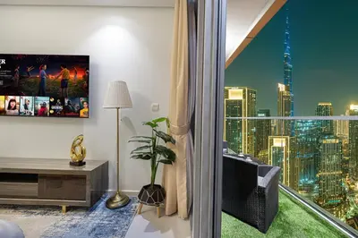 a living room with a view of a city skyline at Burj Khalifa View II Luxury HIGH Floor whith Pool&Spa in Dubai