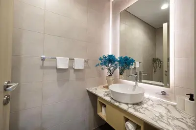 a bathroom with a sink and a mirror at Burj Khalifa View II Luxury HIGH Floor whith Pool&Spa in Dubai