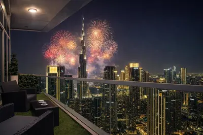 a room with a view of a city with fireworks at Burj Khalifa View II Luxury HIGH Floor whith Pool&Spa in Dubai