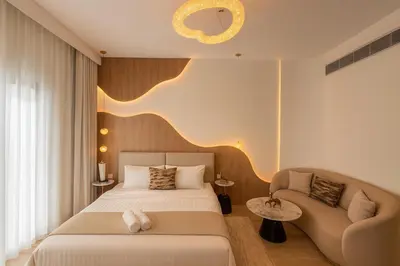 a hotel room with a bed and a chair at Designer Studio near Downtown & Dubai Mall in Dubai