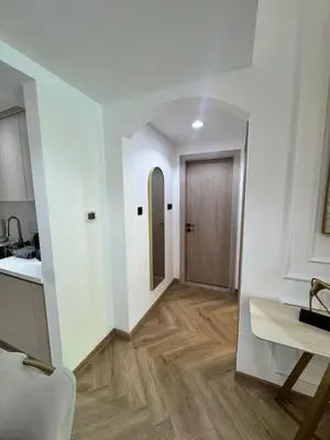 a hallway with a wooden door in a room at Stylish 1BR in Dubai Marina,Walk to JBR in Dubai