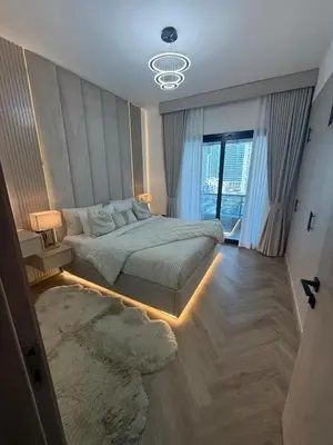 a bedroom with a large bed and a large window at Stylish 1BR in Dubai Marina,Walk to JBR in Dubai
