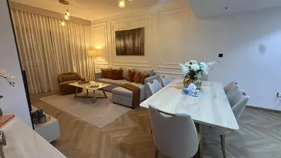 a living room with a table and a couch at Stylish 1BR in Dubai Marina,Walk to JBR in Dubai