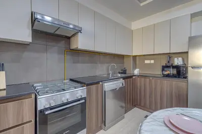 a kitchen with a stove and a sink at Remraam, 1 Bedroom in Al Ramth 11 - Allsopp & Allsopp in Dubai