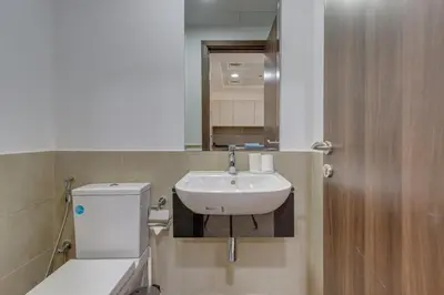 a bathroom with a sink and a toilet and a mirror at Remraam, 1 Bedroom in Al Ramth 11 - Allsopp & Allsopp in Dubai
