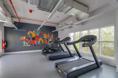 a gym with two tread machines in a room at Remraam, 1 Bedroom in Al Ramth 11 - Allsopp & Allsopp in Dubai