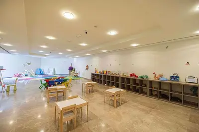 a classroom with tables and chairs in a room at DIFC Sky Gardens Studio In front of DIFC Gate in Dubai