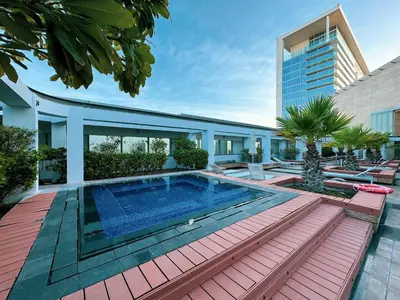 a house with a swimming pool and a building at DIFC Sky Gardens Studio In front of DIFC Gate in Dubai