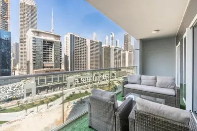 a balcony with a view of a city skyline at RH - Burj Khalifa view with large balcony, 02BR retreat in business bay in Dubai