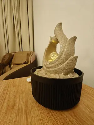 a statue of two birds sitting on a table at 2 Massage Chairs Marina View 2 Bedrooms in Dubai
