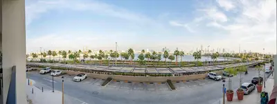 a large parking lot with cars parked in it at Frank Porter - La Voile in Dubai