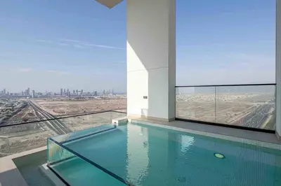 a swimming pool in a building with a view of the city at Frank Porter - Binghatti Onyx in Dubai