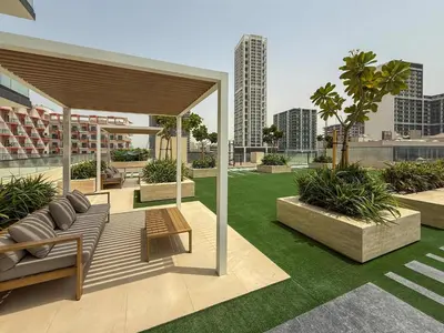 a patio with a couch and a table on a building at Frank Porter - Binghatti Onyx in Dubai