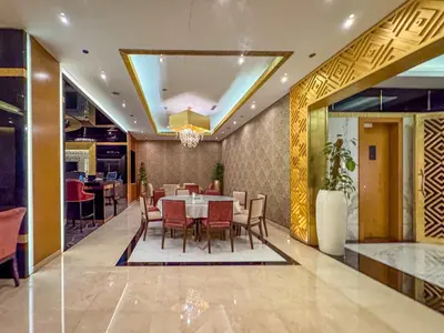 a dining room with a table and chairs at Frank Porter - The Signature in Dubai