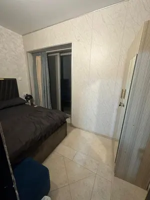 a bedroom with a bed and a door to a room at Sea View Luxe Room Marina Dubai in Dubai