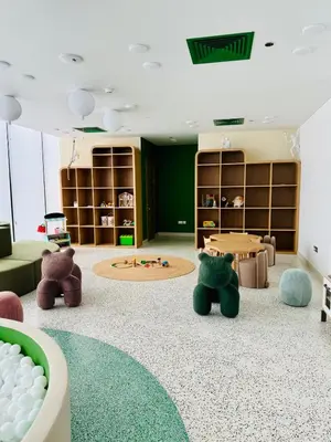 a childrens room with stuffed animals and a table at Elegant Haven by Meraki - New 1 Bed Garden View in Dubai
