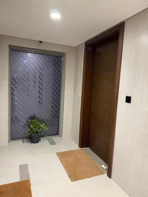 a hallway with a door and a window with a plant at Holiday heaven specious one bed room apartment near Dubai mall with burj khalifa view in Dubai
