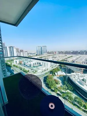 a balcony with a view of a city from a building at Holiday heaven specious one bed room apartment near Dubai mall with burj khalifa view in Dubai