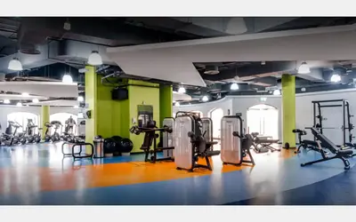 a gym with lots of treadmills and machines at JBR Studio - Steps to Beach & Marina Walk - Pool & Gym in Dubai