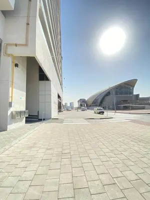 a view of a building with a tiled courtyard at Bright and Stylish Studio - Azizi Aura in Dubai
