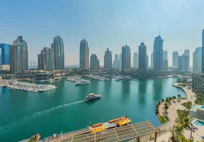 a view of a river with boats in a city at Stylish Two-BHK Apartment - Iris Blue, Marsa Dubai in Dubai