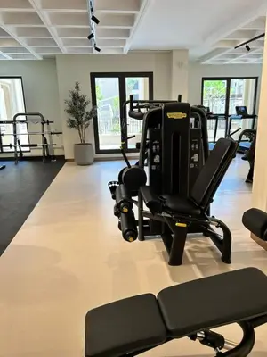 a gym with two tread machines in a room at Comfortable one bed - Gym and Parking in Dubai