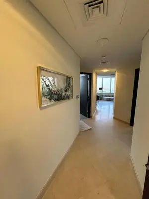 a hallway in a house with a painting on the wall at Luxury 2-Bedroom Apartment in DIFC in Dubai