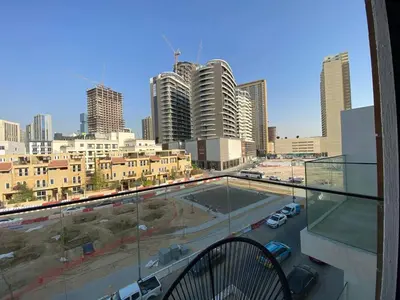 a view of a city from a balcony at Cozy Studio Apartment with Balcony in Dubai