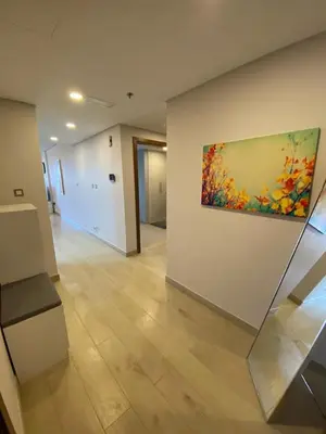 an empty room with a painting on the wall at Entire House in Palm Jumeriah with a Sea View in Dubai