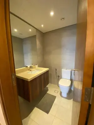 a bathroom with a toilet and a sink at Entire House in Palm Jumeriah with a Sea View in Dubai
