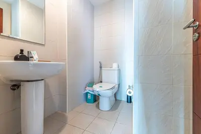 a bathroom with a sink and a toilet at Modern and Cozy One BHK Apt - Heart of Downtown Dubai in Dubai