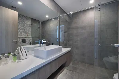 a bathroom with a sink and a shower at Luxury 43rd Floor 2 Bedroom Apartment in Dubai Marina in Dubai