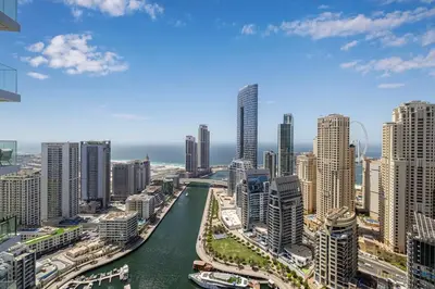 a view of a city with a river and buildings at Luxury 43rd Floor 2 Bedroom Apartment in Dubai Marina in Dubai