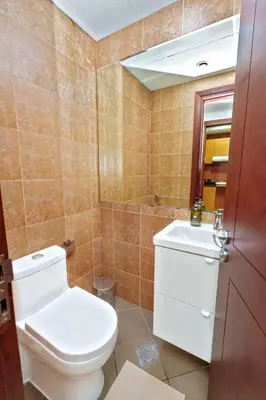 a bathroom with a toilet and a sink at Luxe 1BR Hamilton Residency Business Bay with balcony in Dubai
