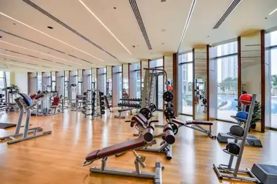 a gym with several treadmills and cardio machines at Downtown Luxury Two Bedroom Apartment I Conntected To Dubai Mall And Metro I Steps Away From Burj Khalifa I by Luxury Space in Dubai