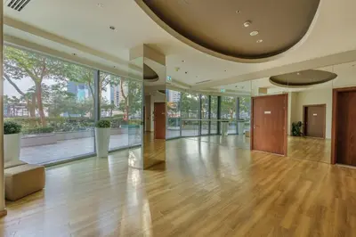 a large lobby with a wooden floor and large windows at Downtown Luxury Two Bedroom Apartment I Conntected To Dubai Mall And Metro I Steps Away From Burj Khalifa I by Luxury Space in Dubai