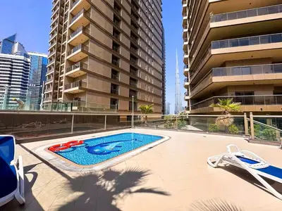 a swimming pool in the middle of a building at Elite Downtown Residence1 Lake View Studio Balcony Apartment in Dubai
