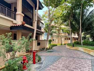 a red fire hydrant in front of a building at Unique Sea View 1BDR Apartment | Anantara Palm in Dubai