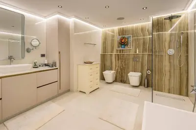 a bathroom with a shower and a sink and a toilet at Unique Sea View 1BDR Apartment | Anantara Palm in Dubai